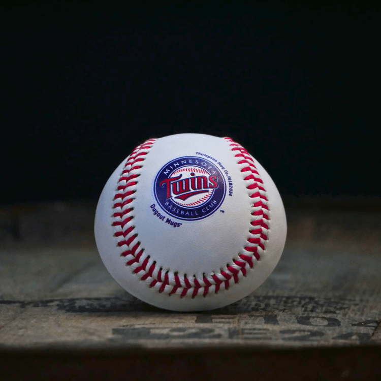 Baseball with Twins logo on a dark background