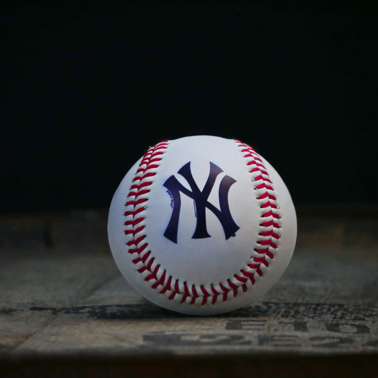 Baseball with New York Yankees logo on a dark background