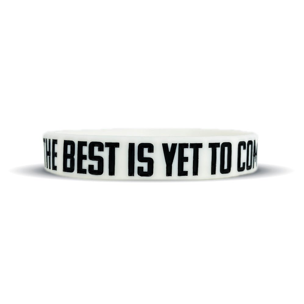White wristband with black text 'The Best is Yet to Come' on a white background