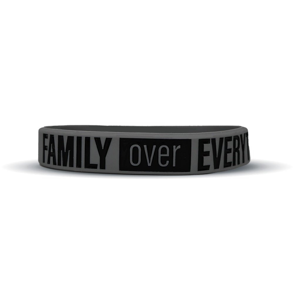 Black wristband with 'FAMILY over EVERYTHING' text on a white background