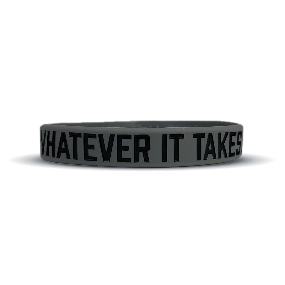 Black wristband with 'Whatever It Takes' text on a white background