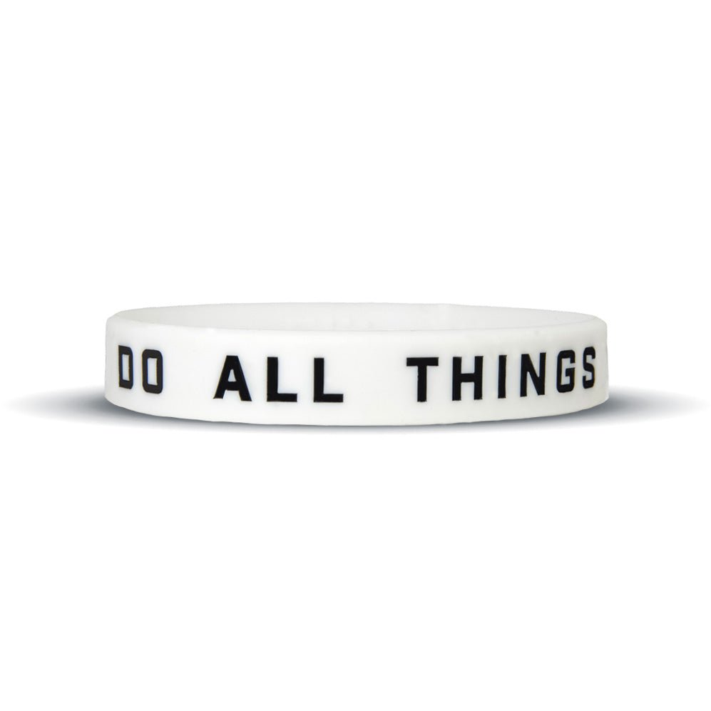 White wristband with 'DO ALL THINGS' text on a white background