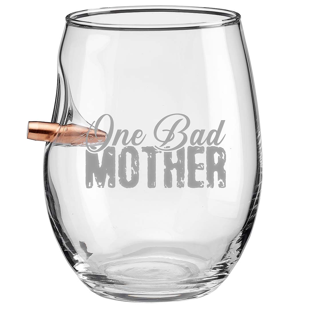 Clear glass wine glass with 'One Bad Mother' text and bullet inside on a white background