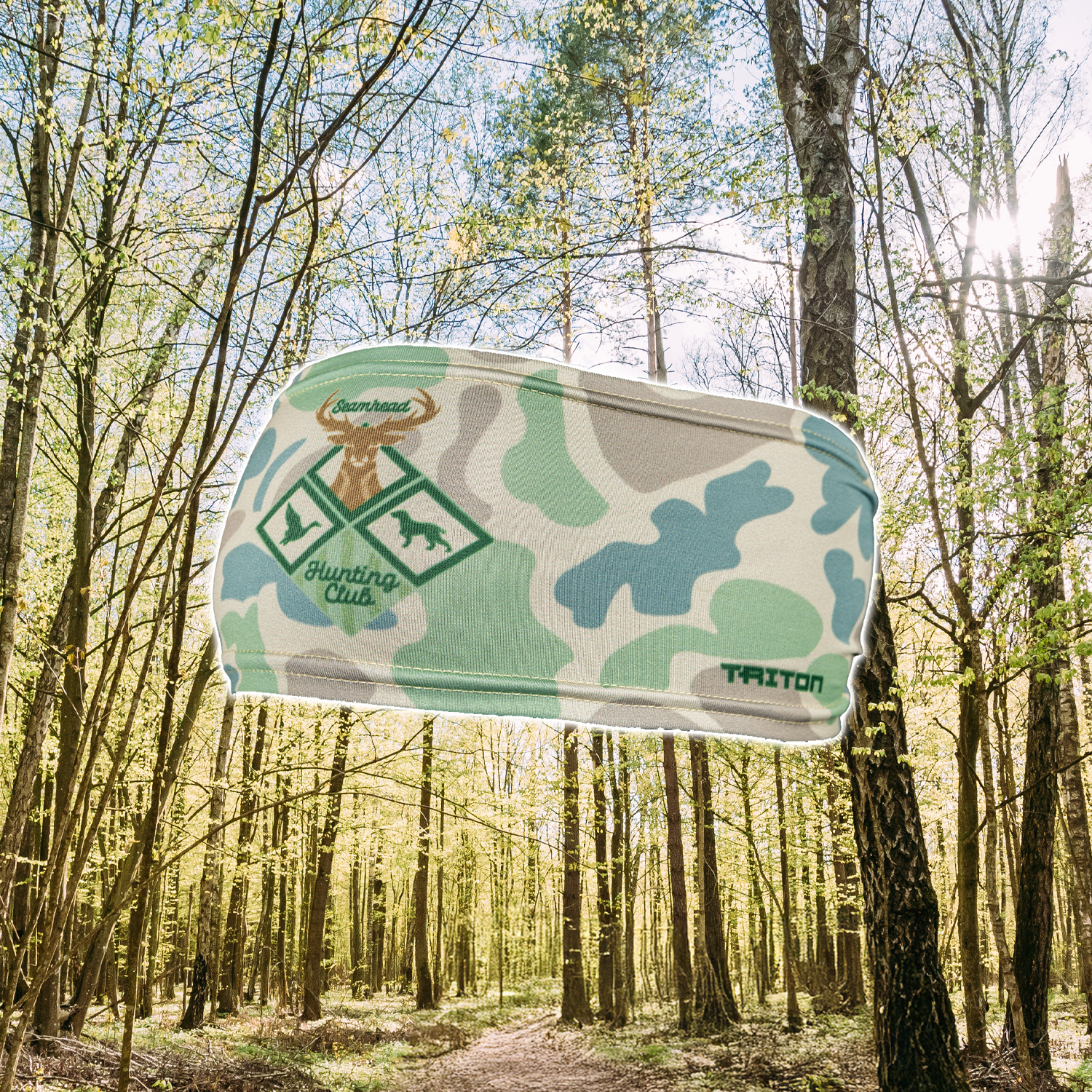 Camouflage-patterned product with hunting club logo in a forest setting