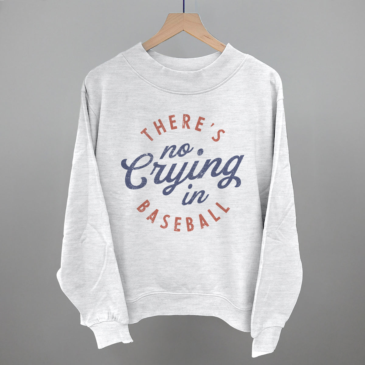 Gray sweatshirt with 'There's no crying in baseball' text on a gray background