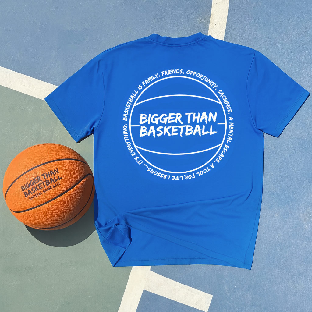 Blue t-shirt with 'Bigger Than Basketball' text on a basketball court