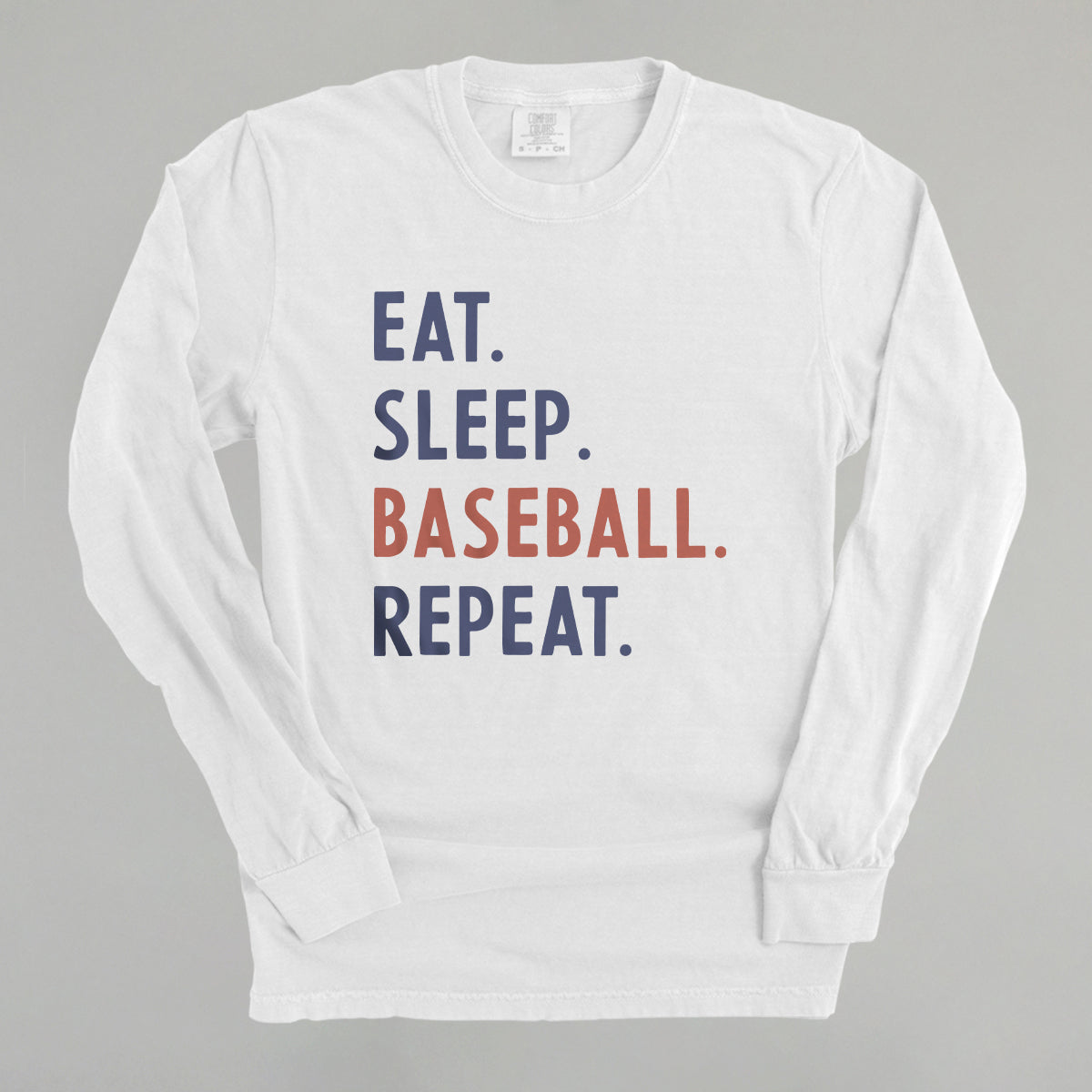Collection of White long-sleeve shirt with 'Eat. Sleep. Baseball. Repeat.' text on a gray background in a gallery layout