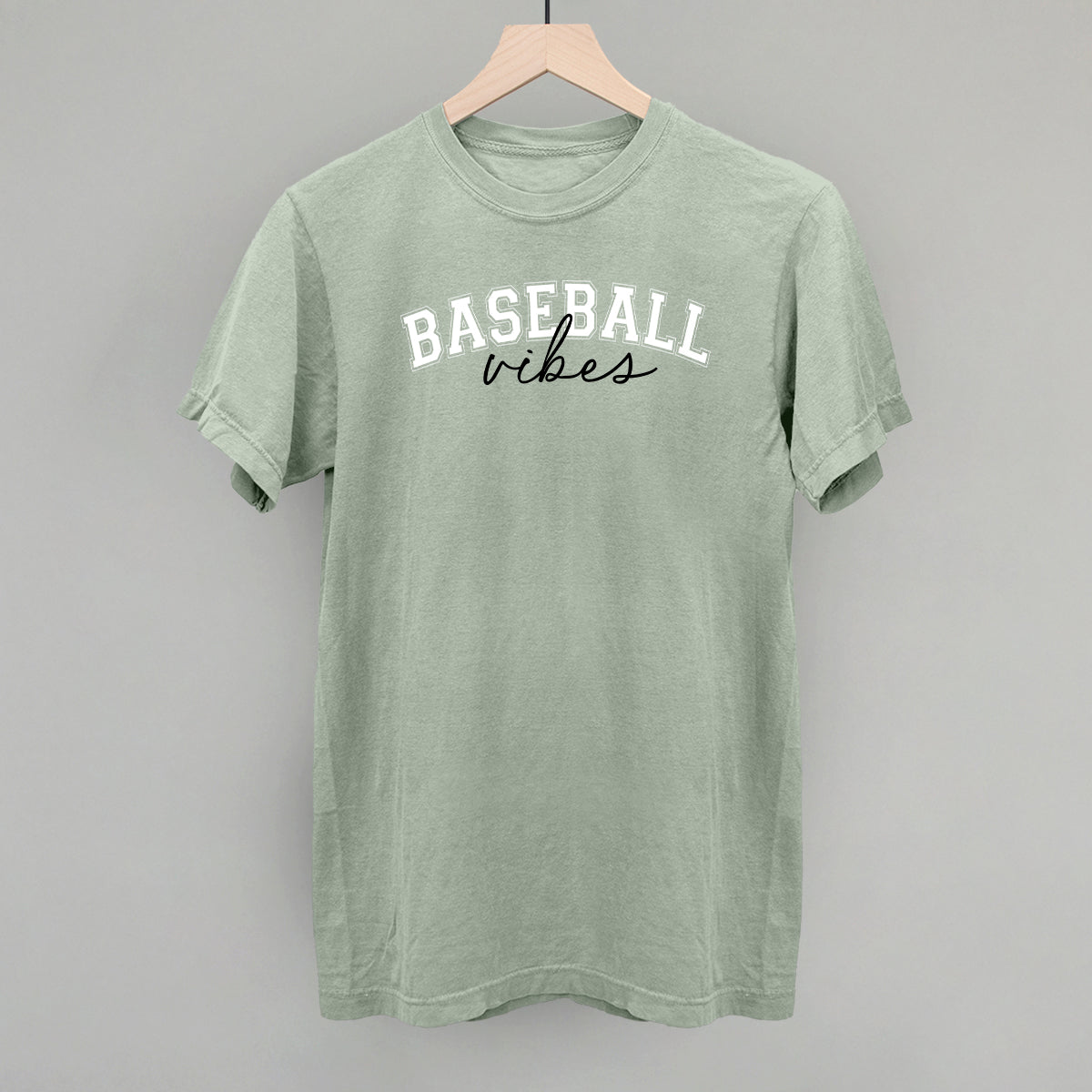 Collection of Green t-shirt with 'Baseball vibes' text on a gray background in a gallery layout