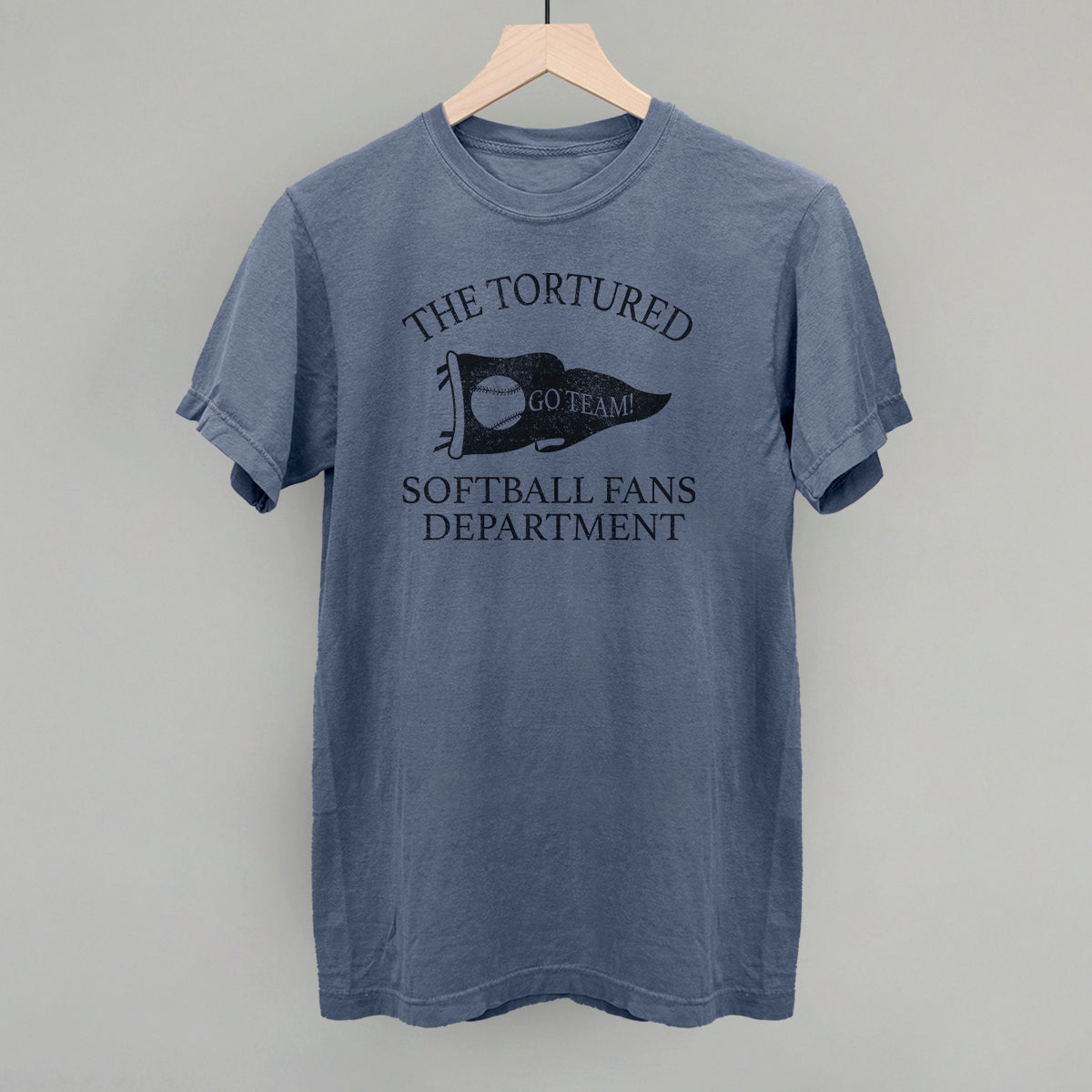 Blue t-shirt with text that says the tortured Softball fans department 