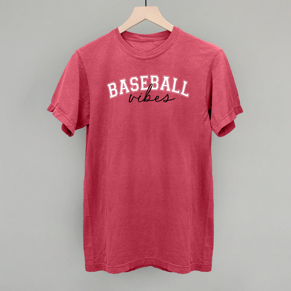 Red t-shirt with 'BASEBALL vibes' text on a gray background