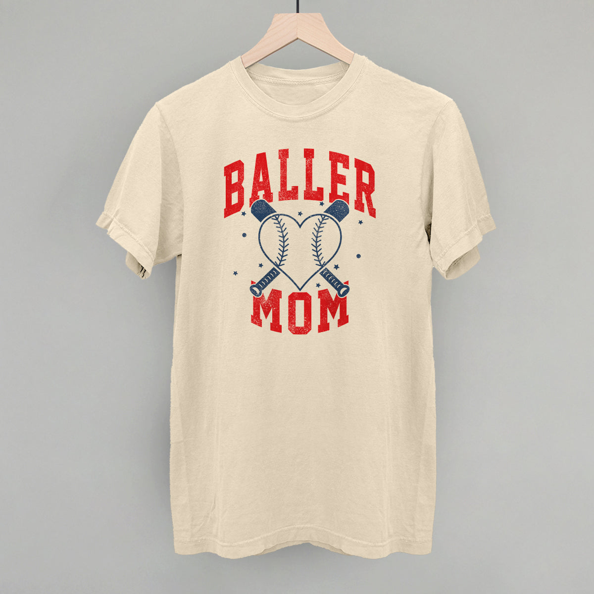 Collection of Beige t-shirt with 'Baller Mom' text and baseball graphics on a gray background in a gallery layout