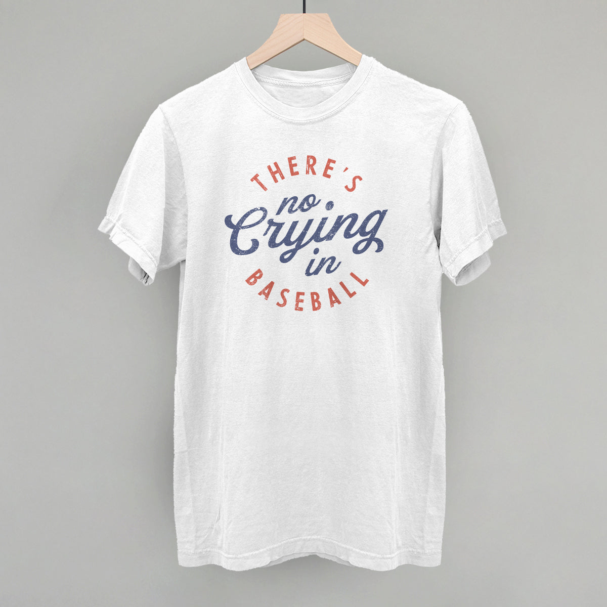 White t-shirt with 'There's no crying in baseball' text on a gray background