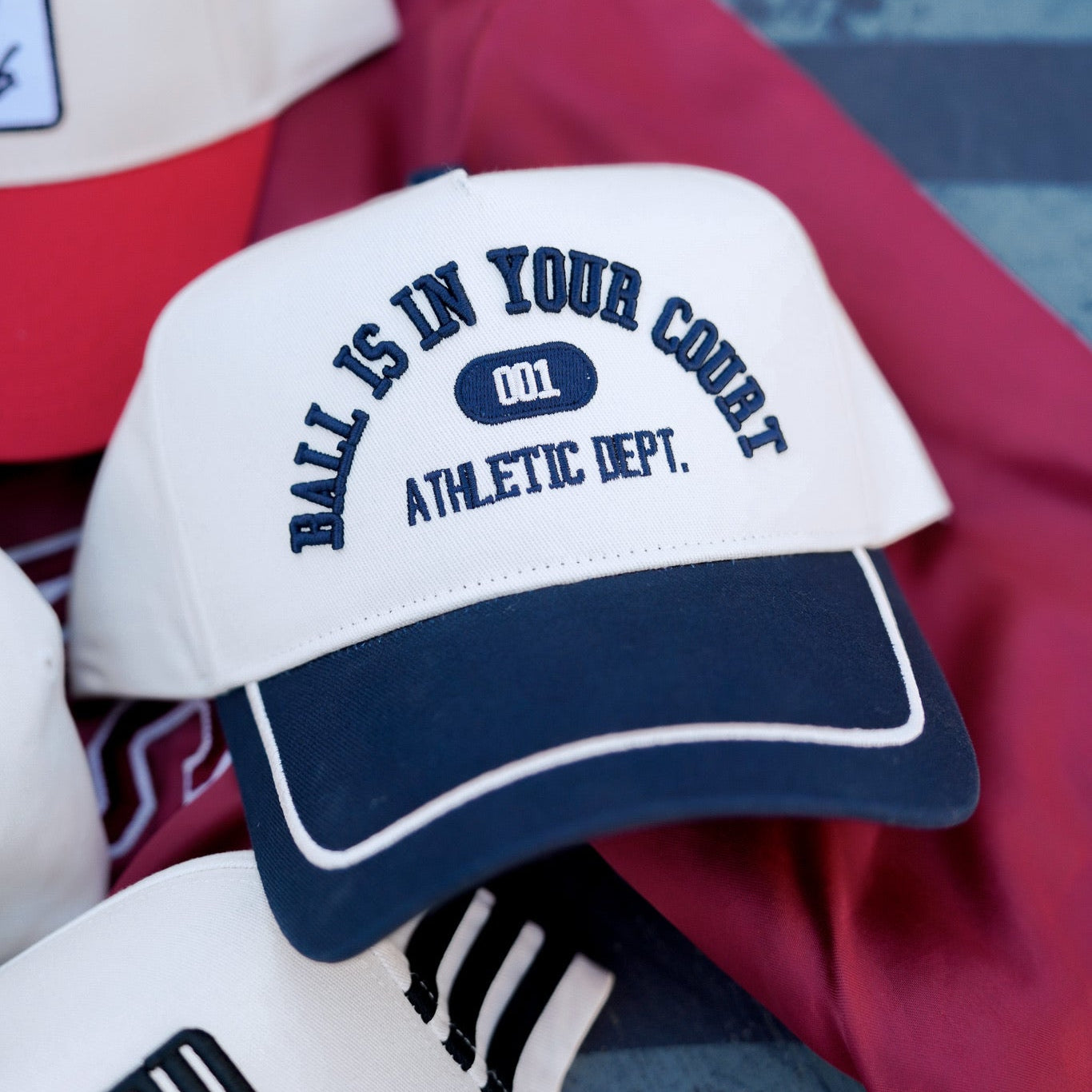 Collection of Hero: Ball Is In Your Court navy vintage trucker hat cream navy varsity embroidery Athletic Dept snapback sports hat in a gallery layout