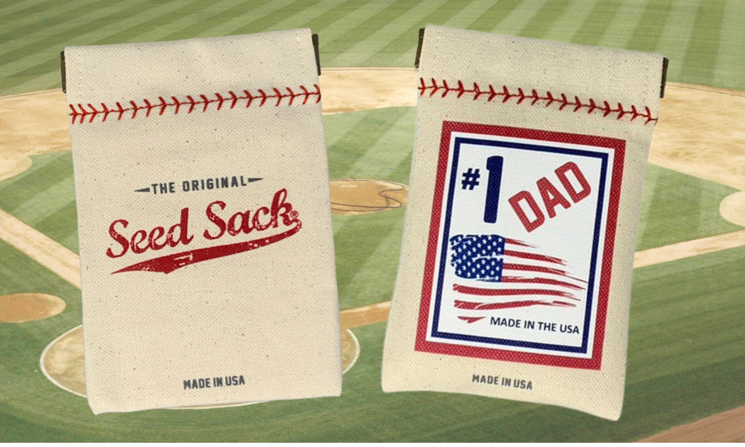 Two seed sacks with baseball-themed designs on a baseball field background