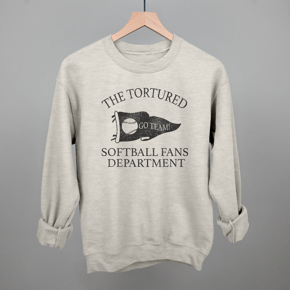 oatlmeal sweatshirt with printed text that says the tortured Softball fans department 
