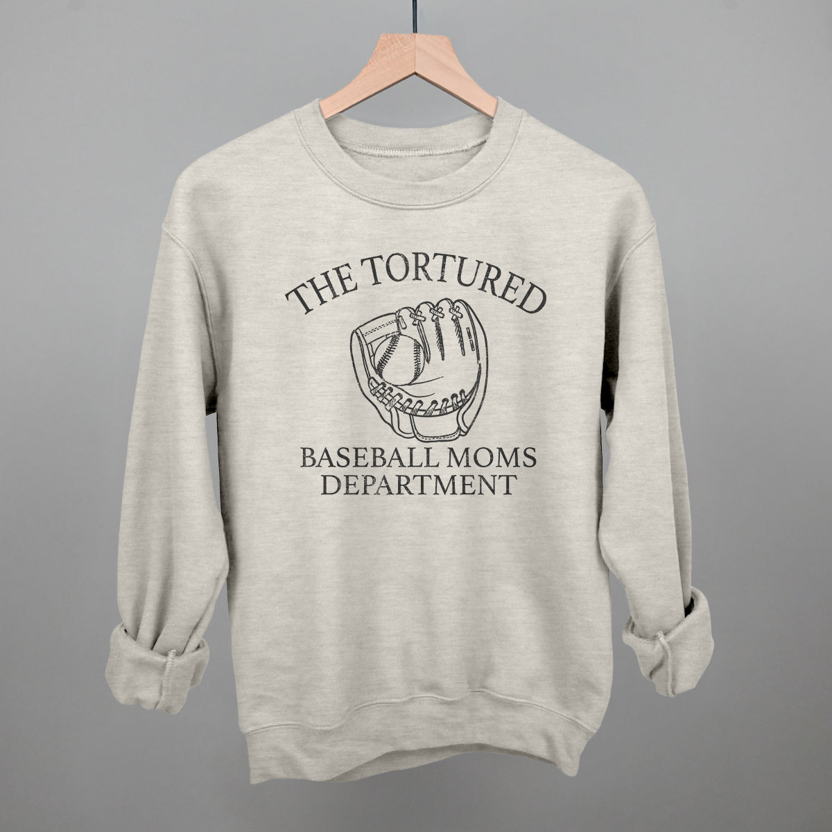 Gray sweatshirt with 'The Tortured Baseball Moms Department' text and graphic on a gray background