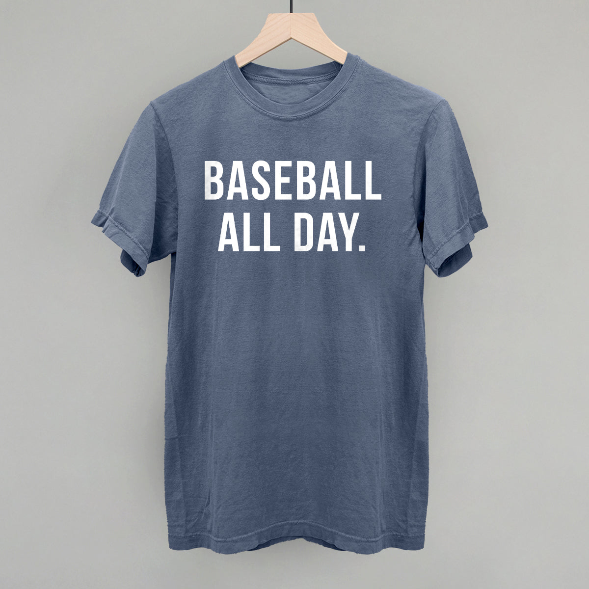 Blue t-shirt with 'BASEBALL ALL DAY.' text on a gray background