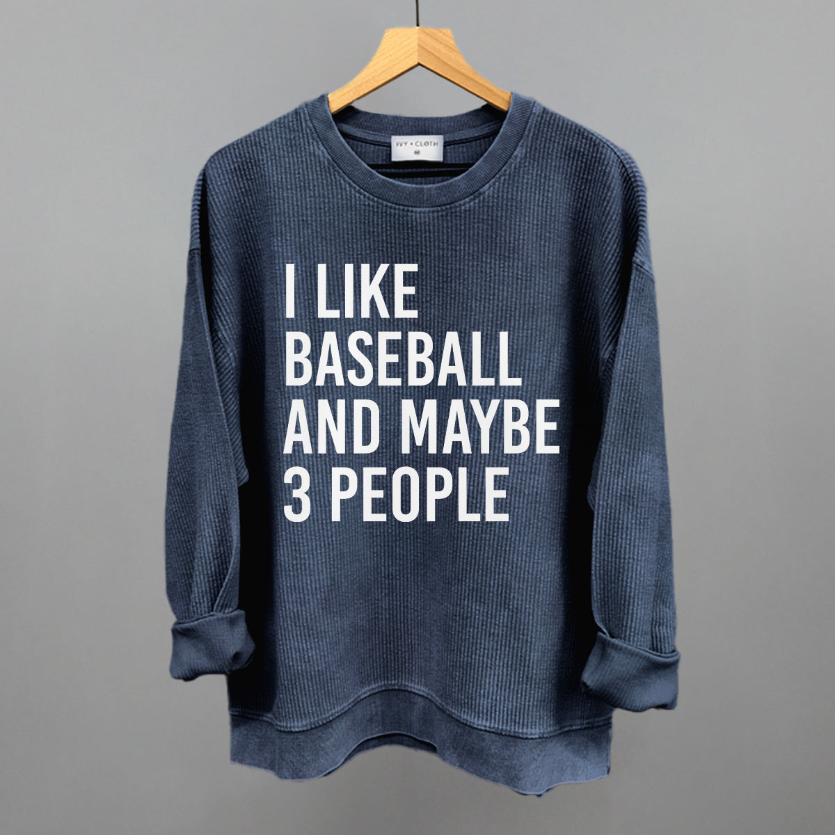Collection of Corded Crew Navy Blue sweatshirt with text 'I LIKE BASEBALL AND MAYBE 3 PEOPLE' on a gray background in a gallery layout