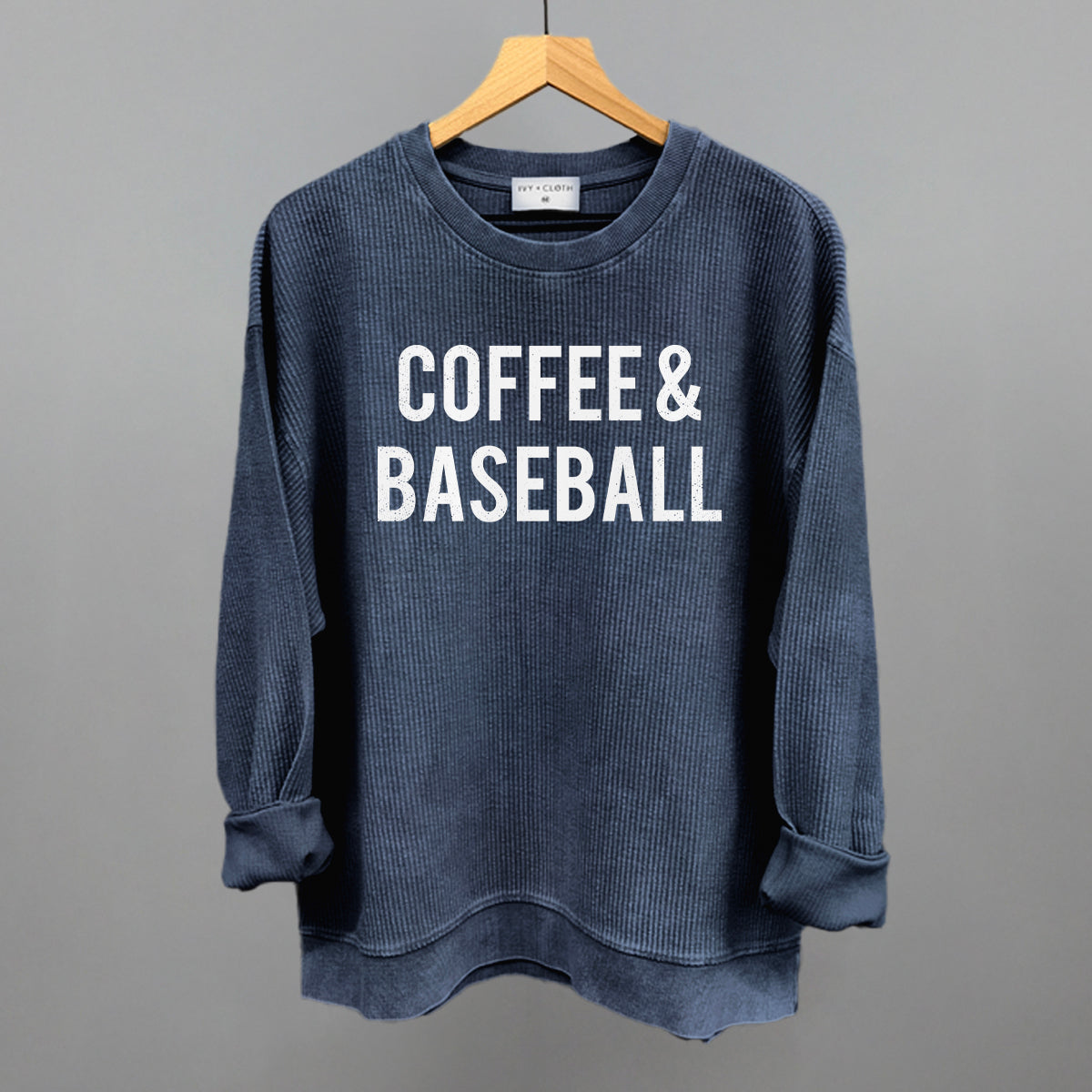 Navy comfort colors sweatshirt with 'COFFEE & BASEBALL' text on a gray background