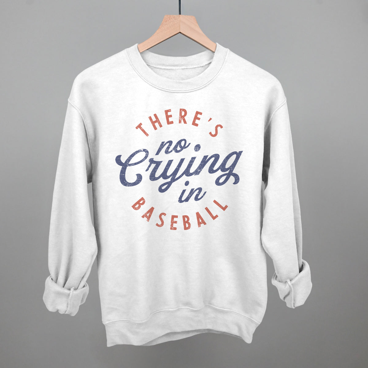 Collection of White sweatshirt with 'There's no crying in baseball' text on a gray background in a gallery layout