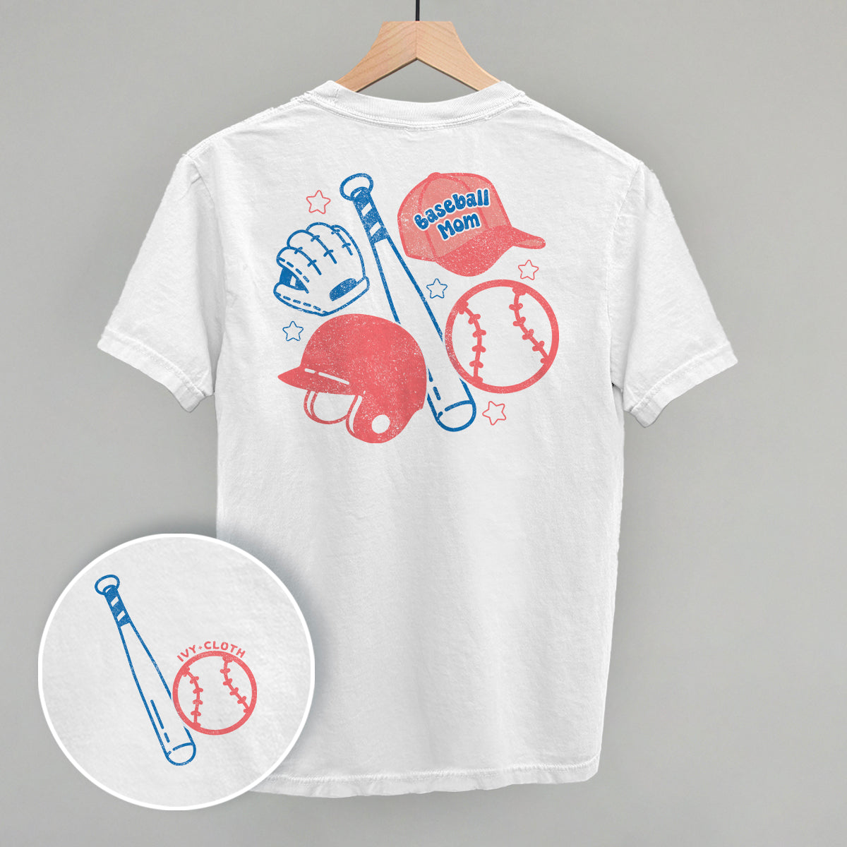 White t-shirt with baseball-themed graphics on a gray background