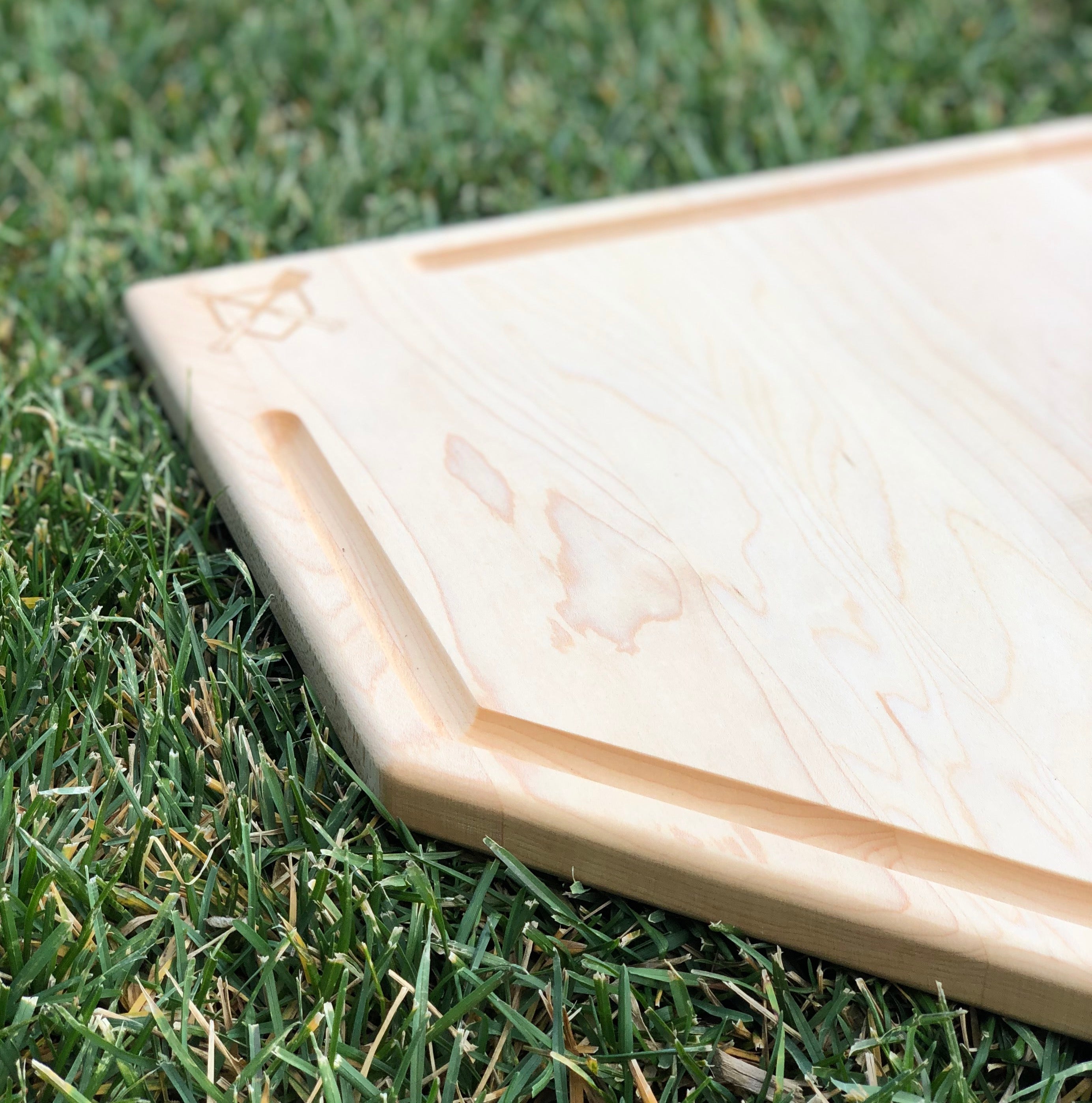 Collection of Wooden rectangular baseball cutting board on grass in a gallery layout