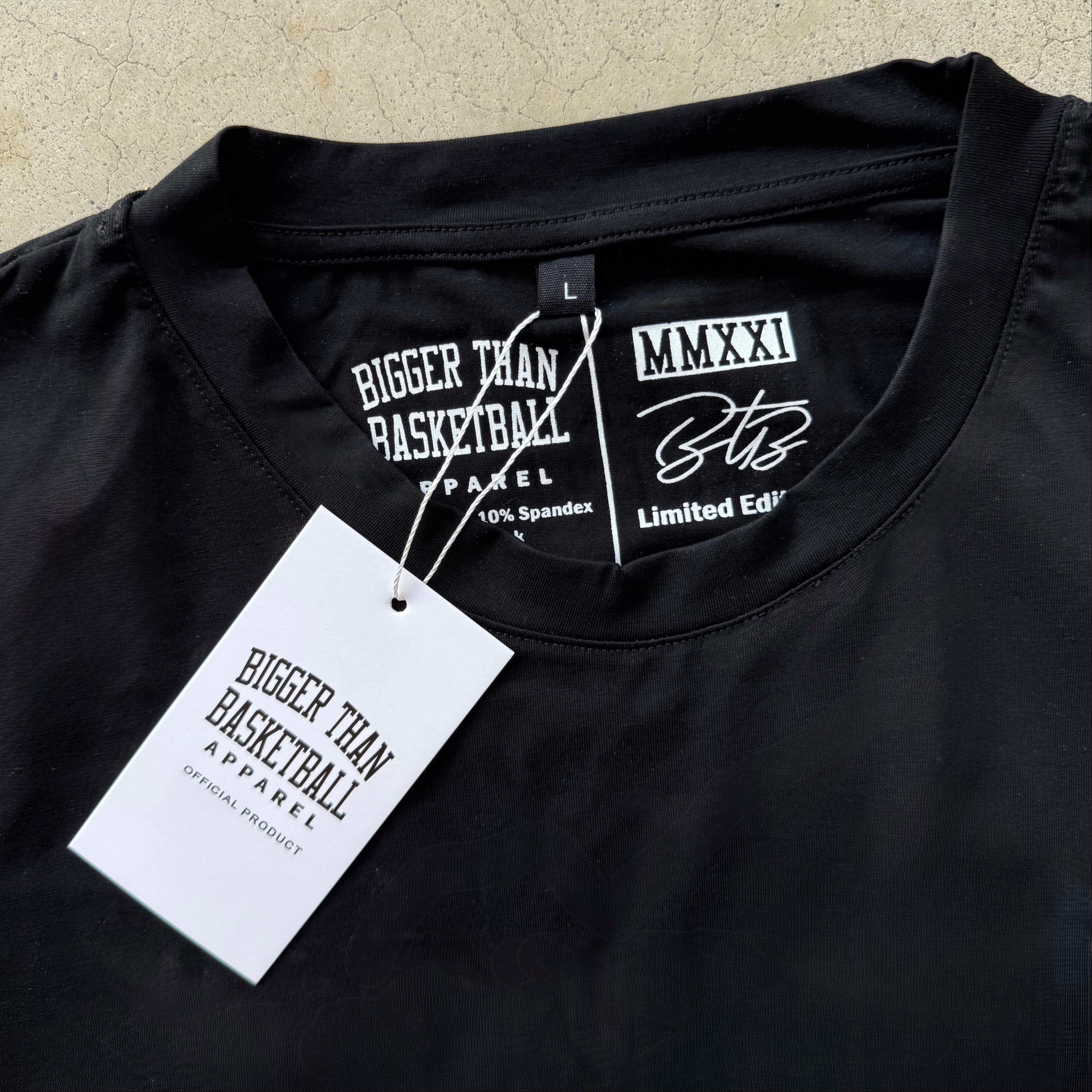 Collection of Black apparel with branding and size label on a textured beige background in a gallery layout