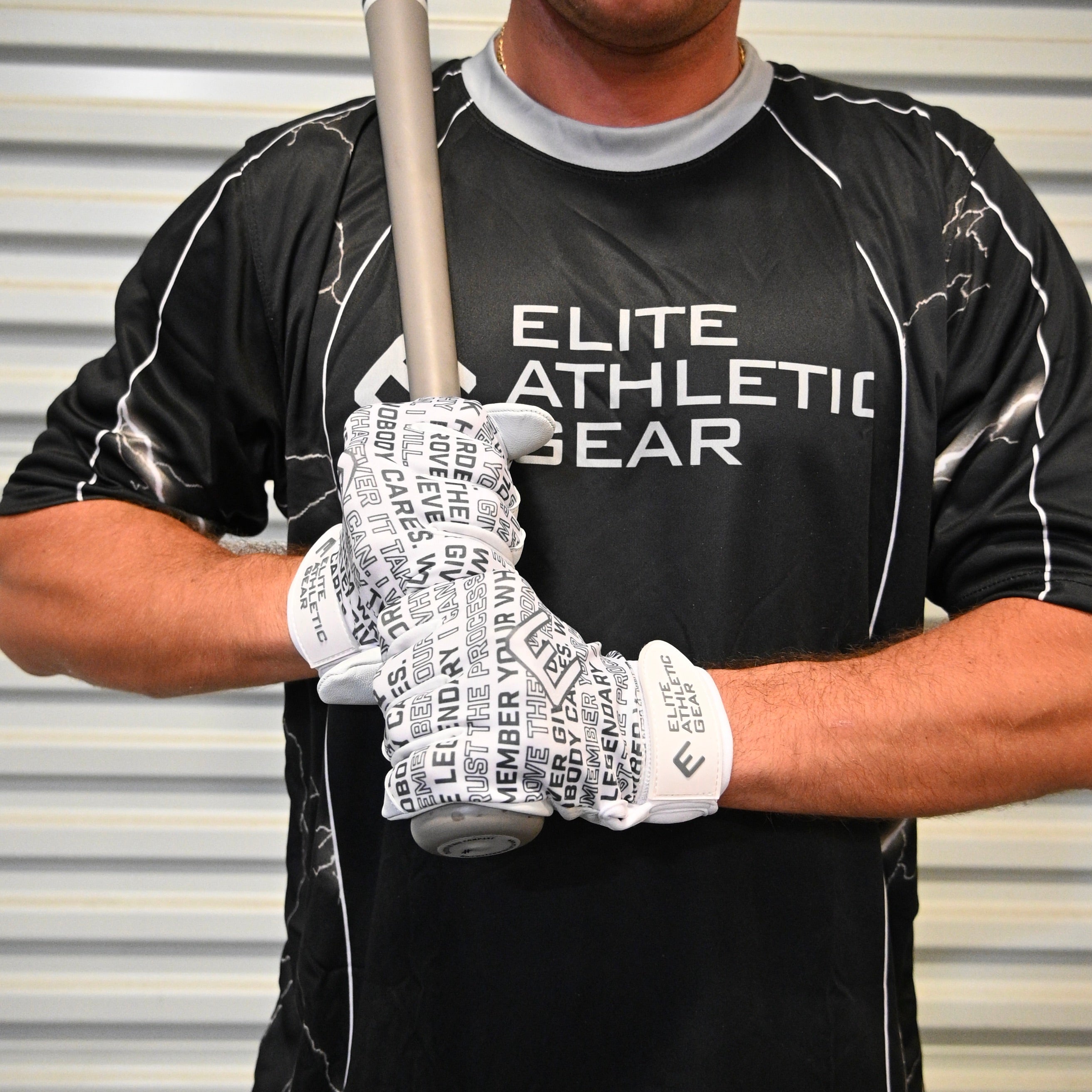 Collection of Person wearing a black 'Elite Athletic Gear' shirt and white motivational saying batting gloves with text, holding a baseball bat. in a gallery layout