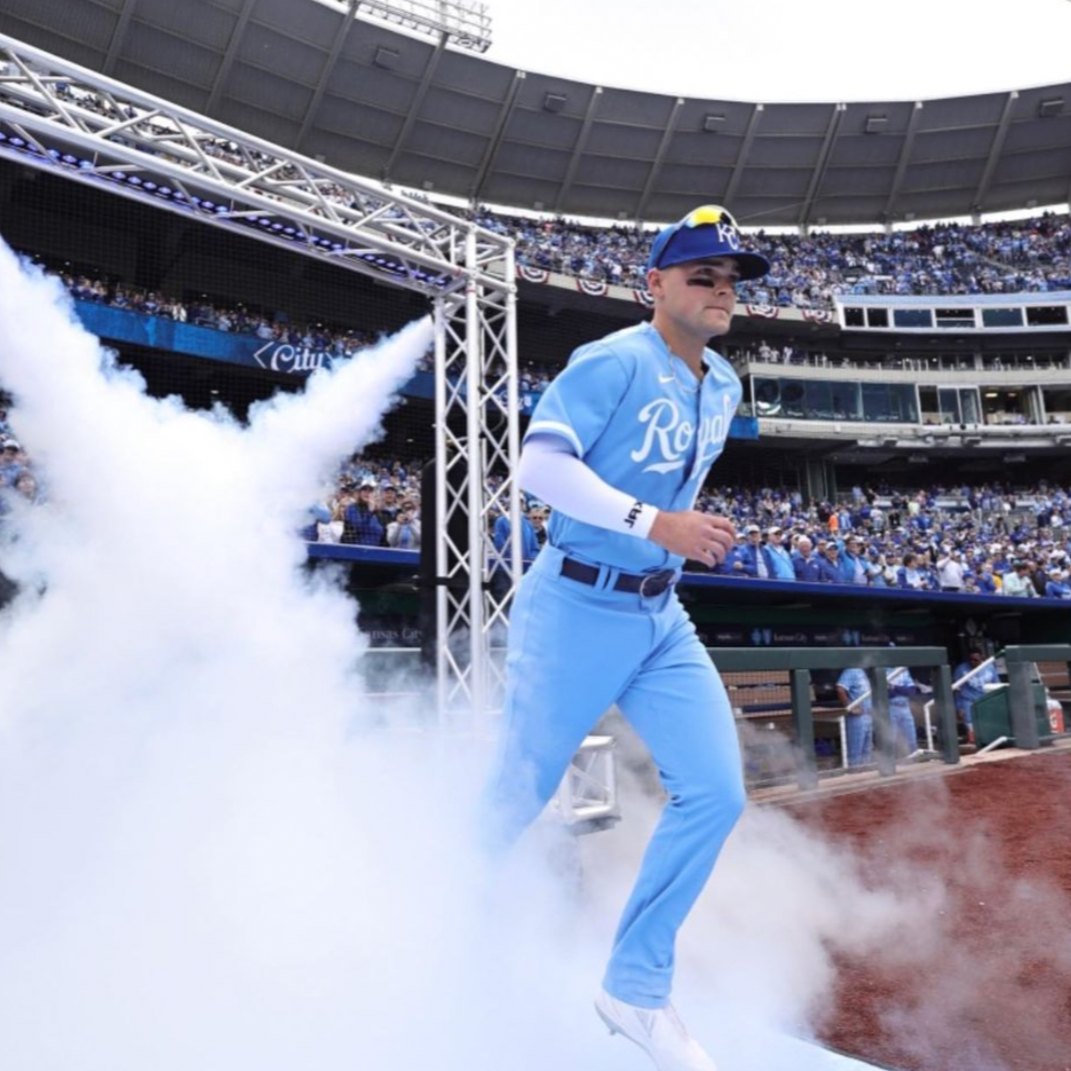 Collection of Person in a blue baseball uniform walking through smoke at a stadium in a gallery layout