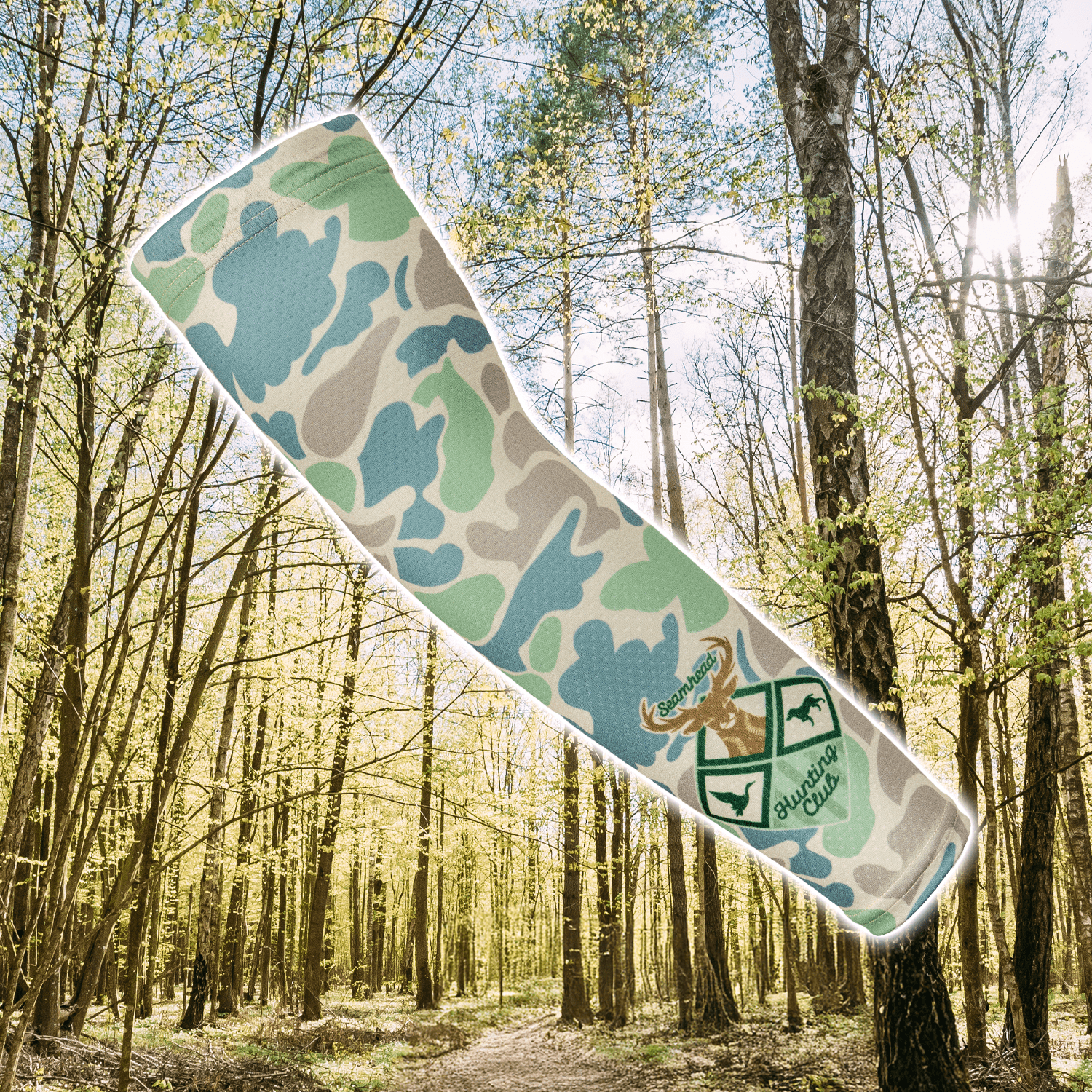 Collection of Camouflage-patterned baseball arm sleeve product with a logo on a forest background in a gallery layout