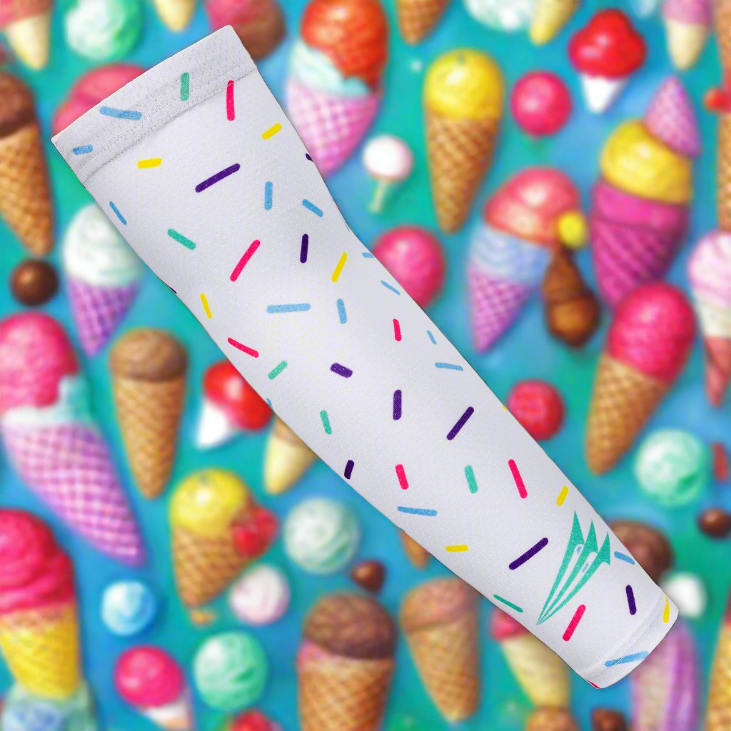 Collection of White baseball arm sleeve drip colorful sprinkles against a background of ice cream cones and colorful balls in a gallery layout