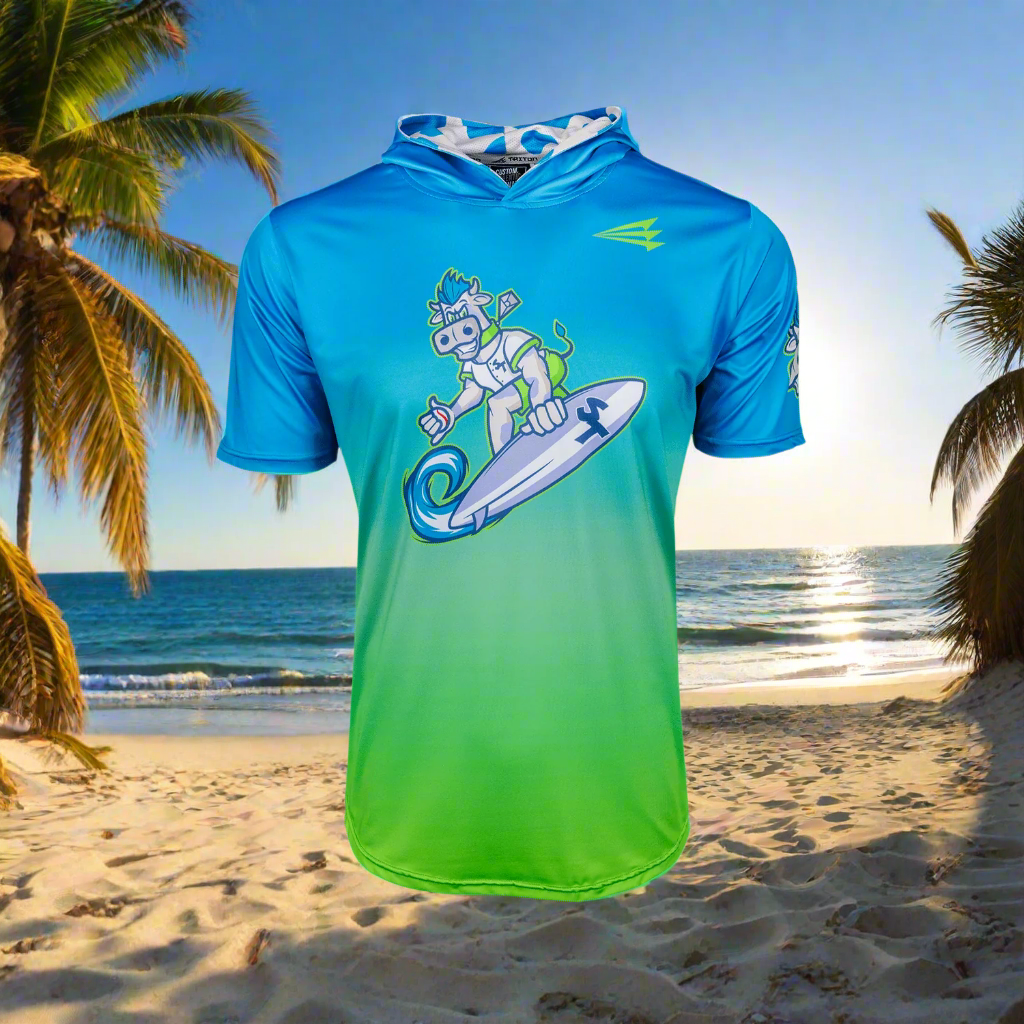 Collection of Blue and green short sleeve surf and turf hoodie with a graphic design on a beach in a gallery layout
