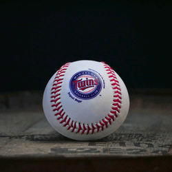 Collection of Baseball with Twins logo on a dark background in a gallery layout