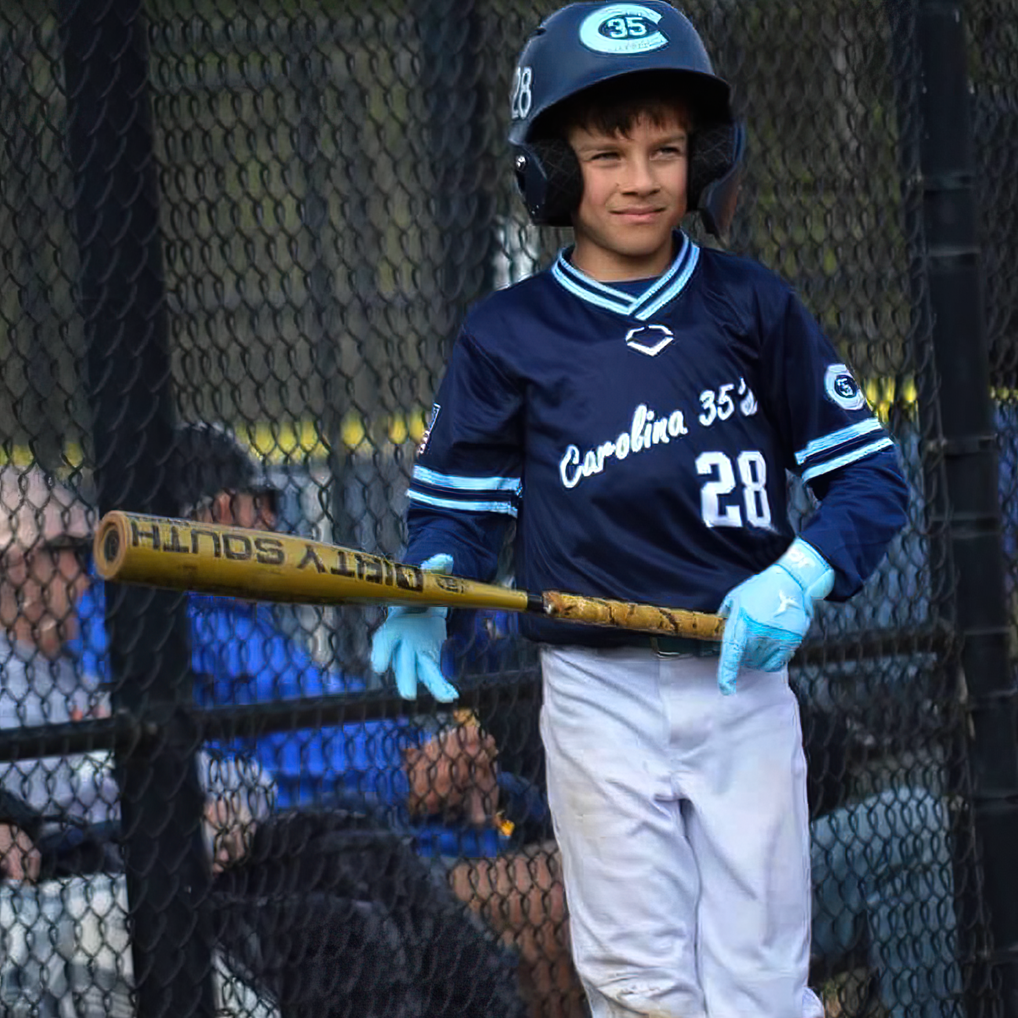 Collection of Young baseball player in uniform holding a bat in a dugout wearing baby blue JAX batting gloves in a gallery layout