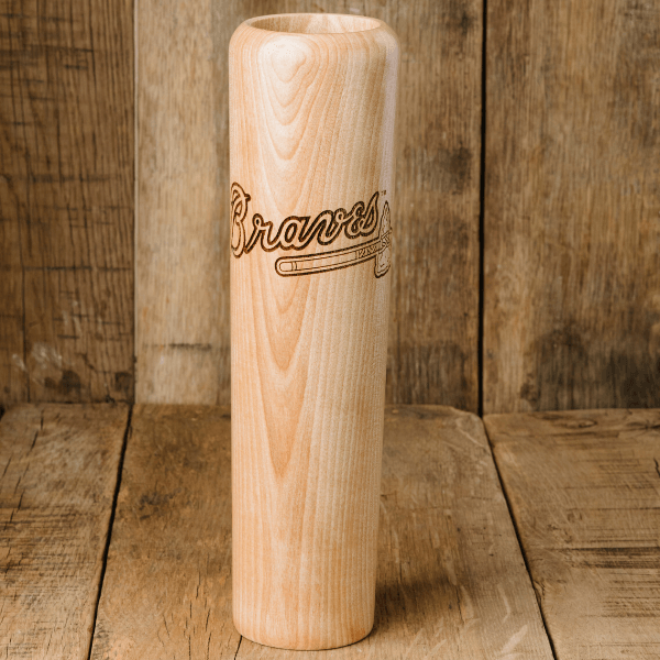 Collection of Wooden baseball bat with 'Braves' engraving on a wooden background in a gallery layout