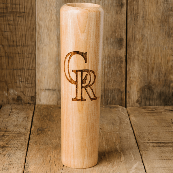 Collection of Wooden vase with engraved initials 'GR' on a wooden background in a gallery layout