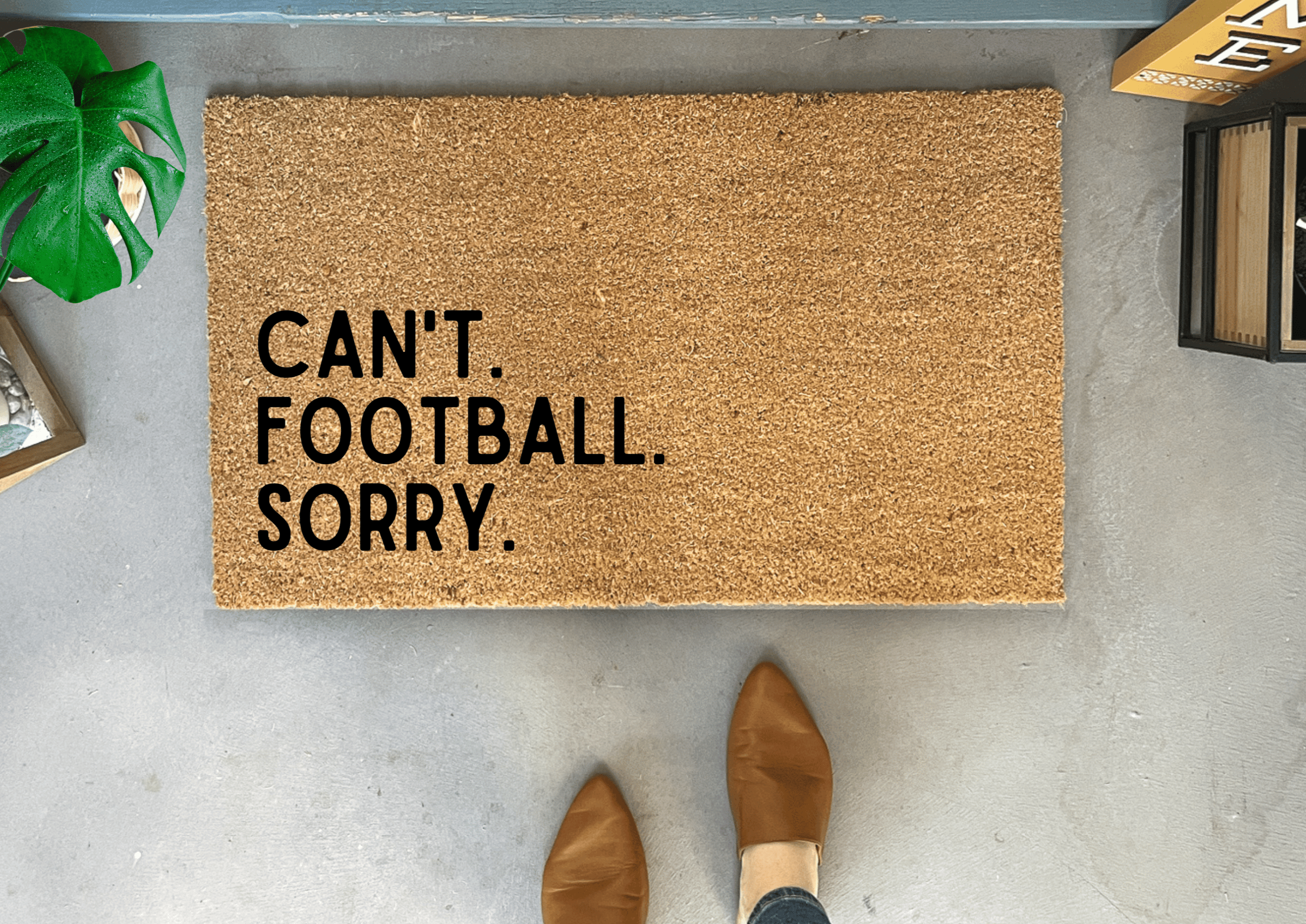 Collection of Doormat with 'CAN'T. FOOTBALL. SORRY.' text on a concrete floor. in a gallery layout