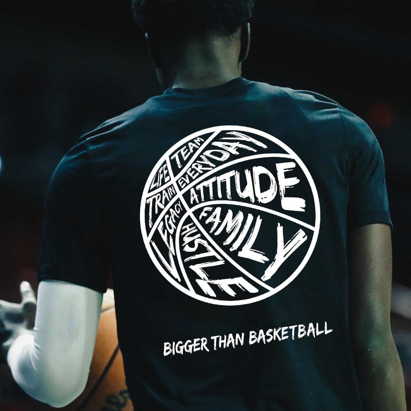 Collection of Person wearing a black t-shirt with white text and graphics, including 'Attitude Family Hustle Bigger Than Basketball'. in a gallery layout
