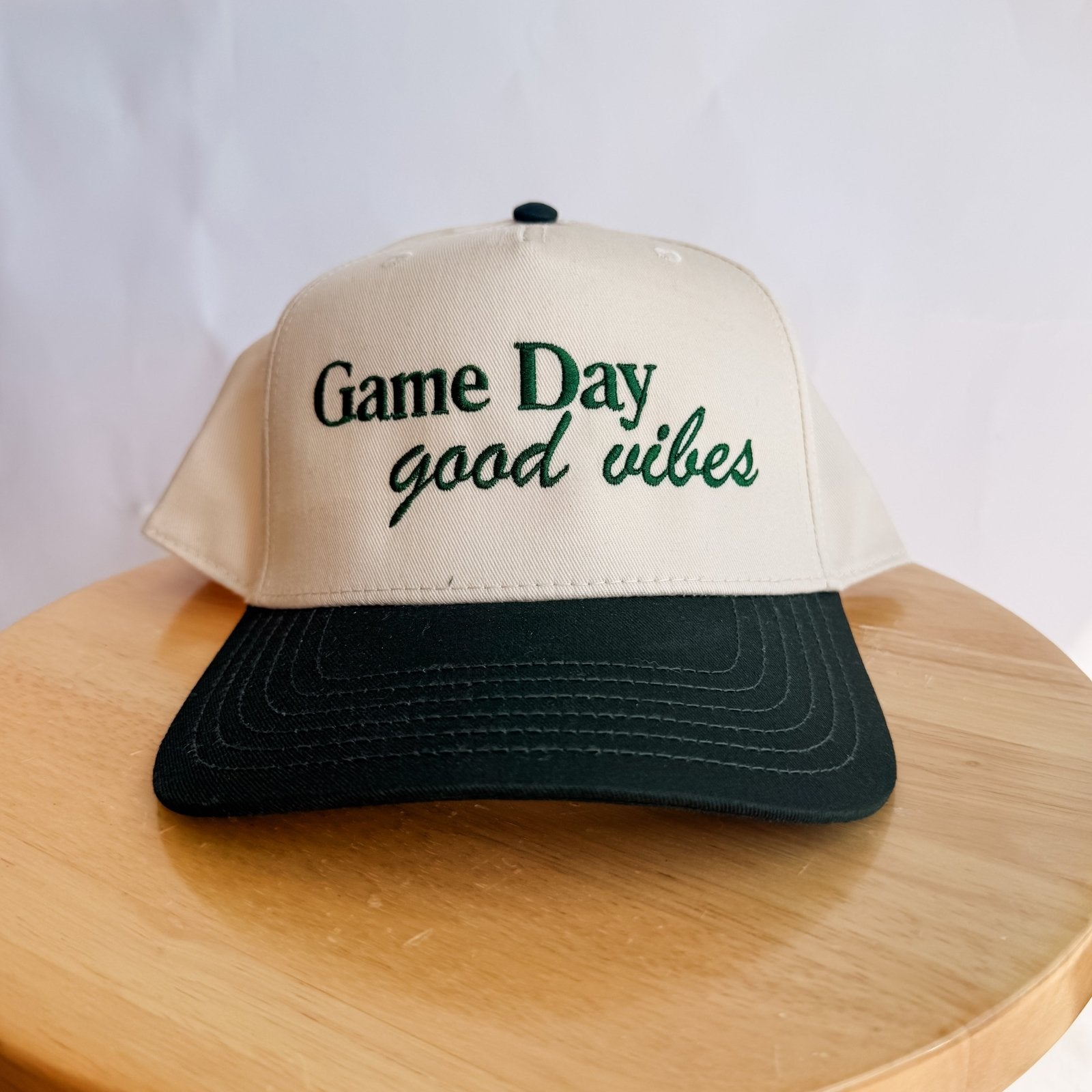 Collection of Game Day Good Vibes embroidered trucker hat natural canvas dark brim baseball mom hat in a gallery layout