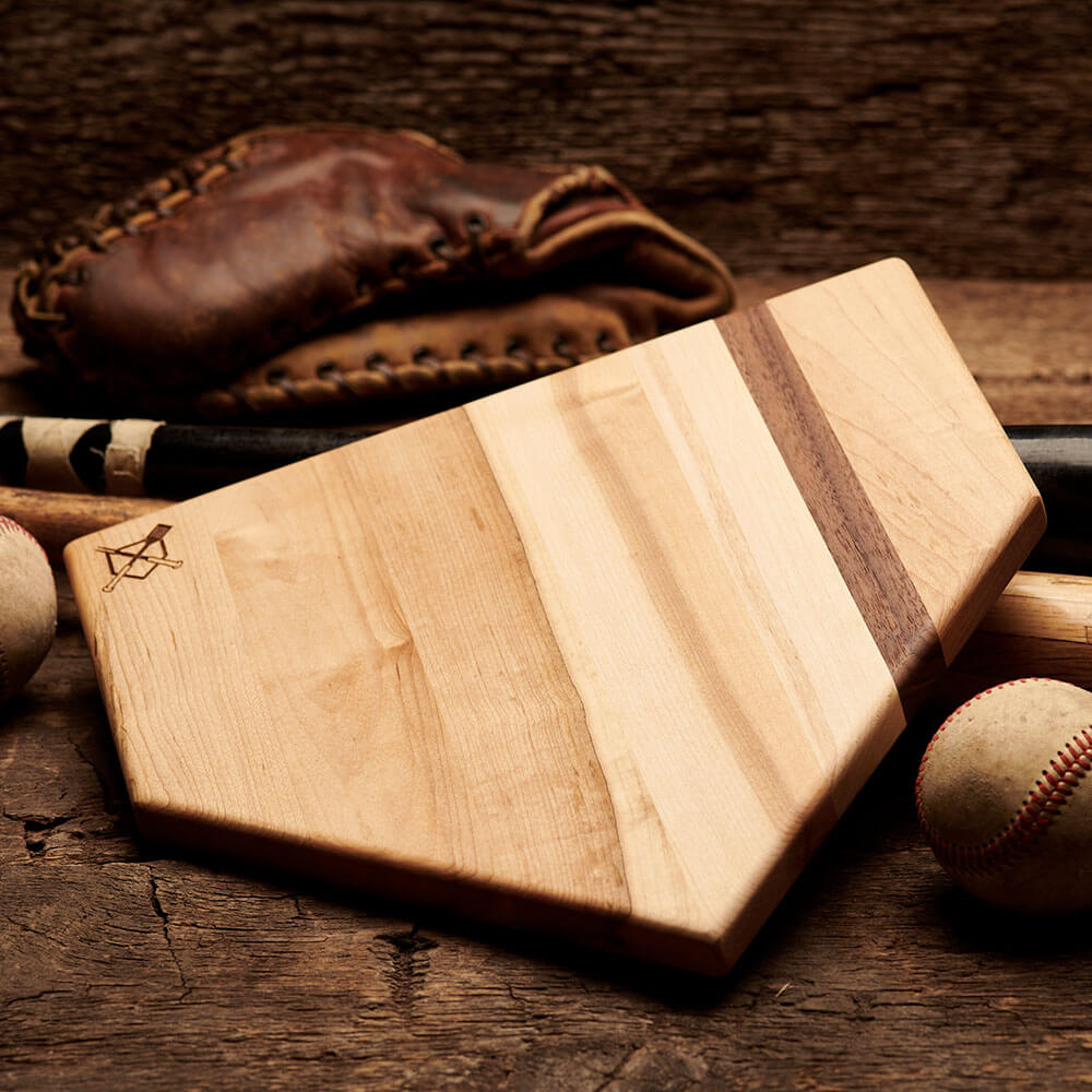 Collection of Baseball Home plate Wooden cutting board with a baseball and leather glove on a wooden surface in a gallery layout