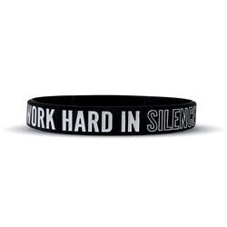 Collection of Black wristband with white text 'WORK HARD IN SILENCE' on a white background in a gallery layout